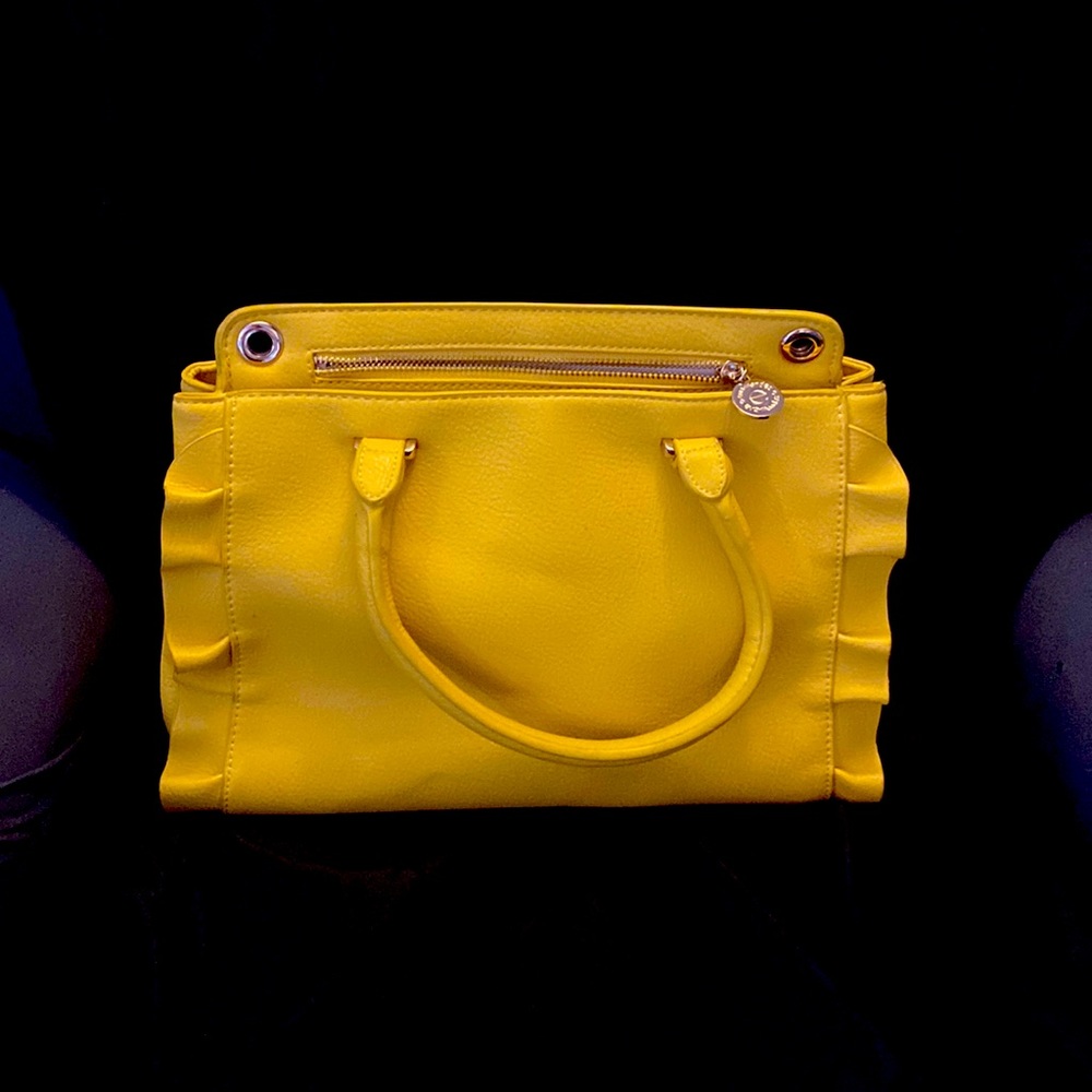 YELLOW EVA MENDES NEW YORK & COMPANY HANDBAG. It has 2 dividers with zippers.